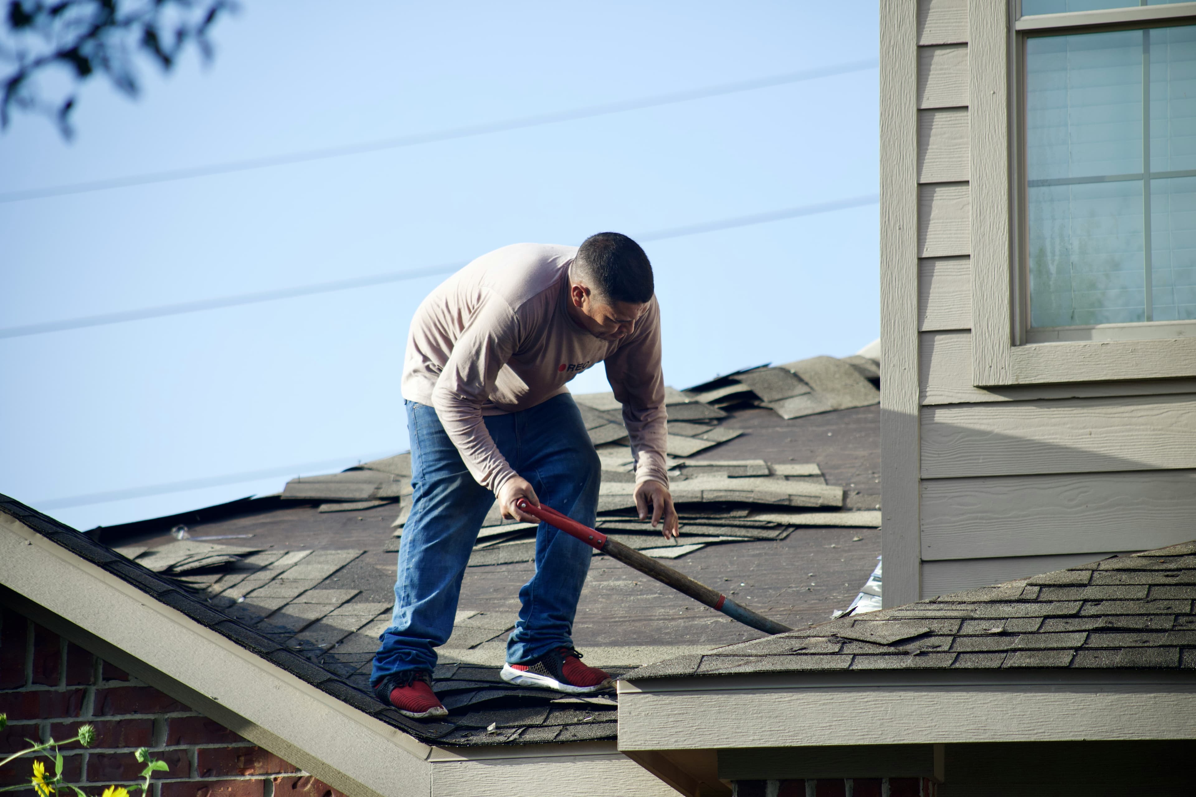 Worker On Roof